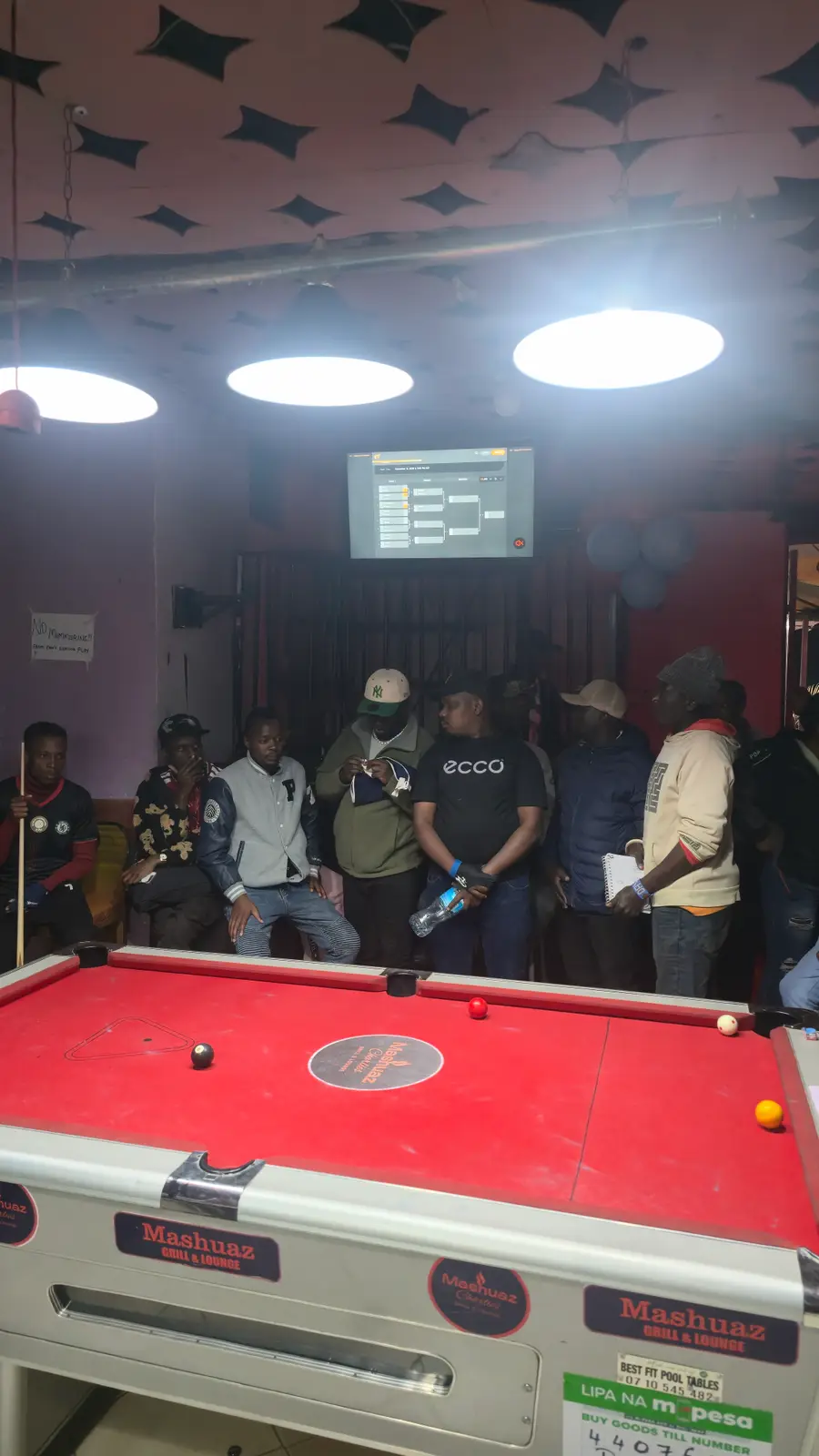 Players and spectators waiting for the next match